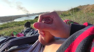 YOUNG RUSSIAN GUY JERKS OFF BY THE RIVER