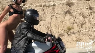 Sexy biker chick fucking the dildo whilst riding a bike